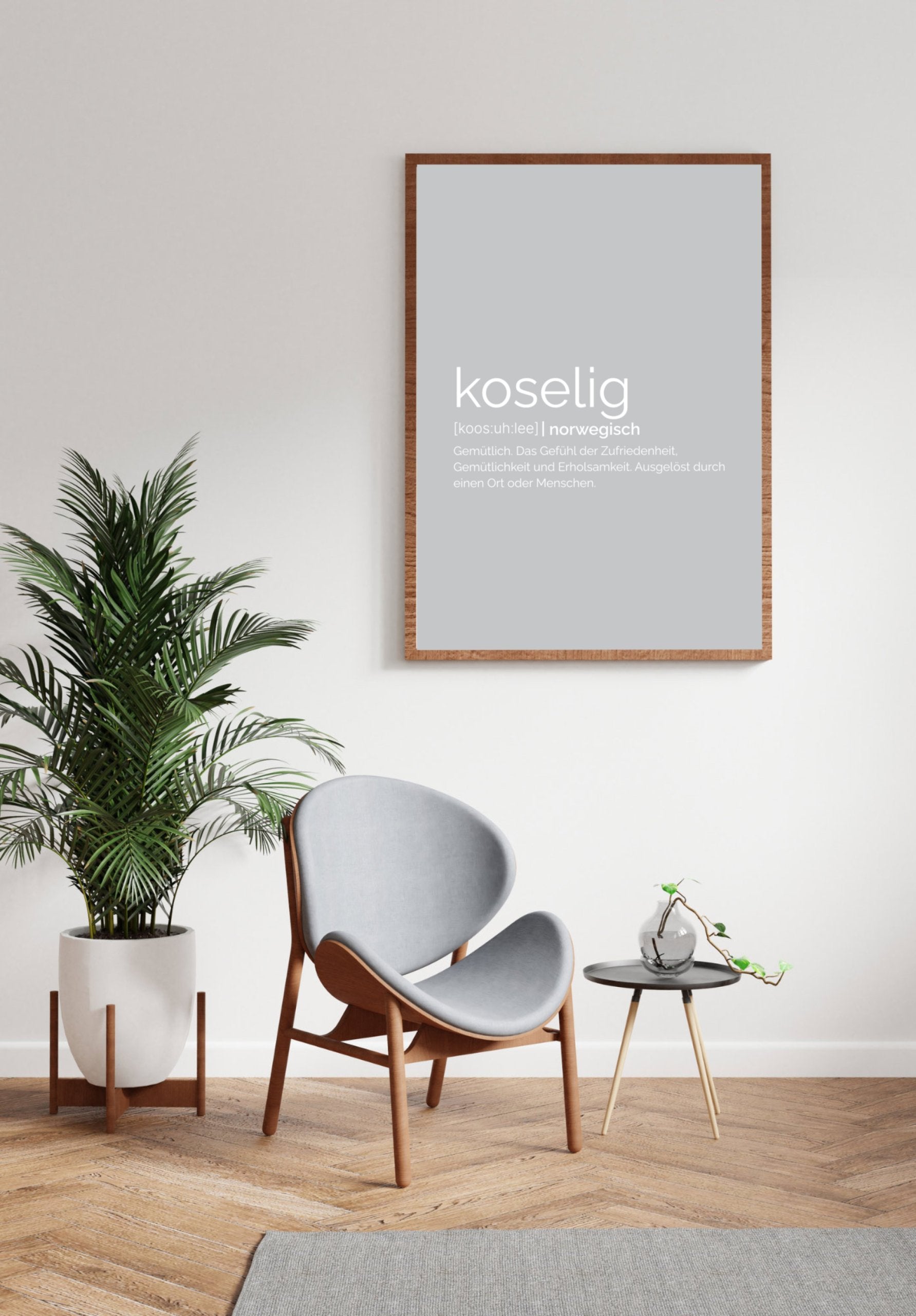 MOTIVISSO Poster Koselig in grau im Bilderrahmen an Wand, da drunter Pflanze und Stuhl